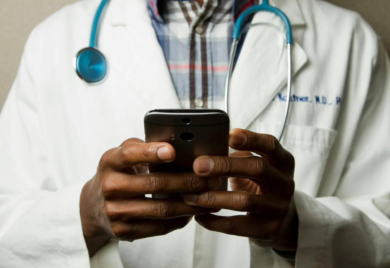 Clinician reviewing the Lumen Health companion app on a phone